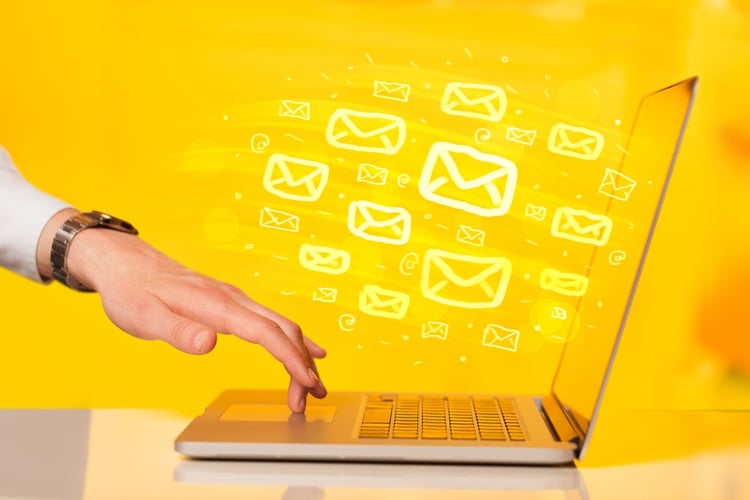 HubSpot vs. Pardot | Campaigns | Sending emails on laptop