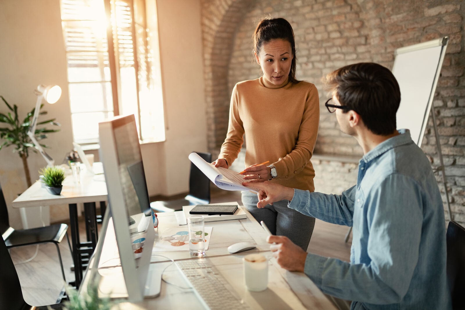 Client and strategist reviewing paperwork